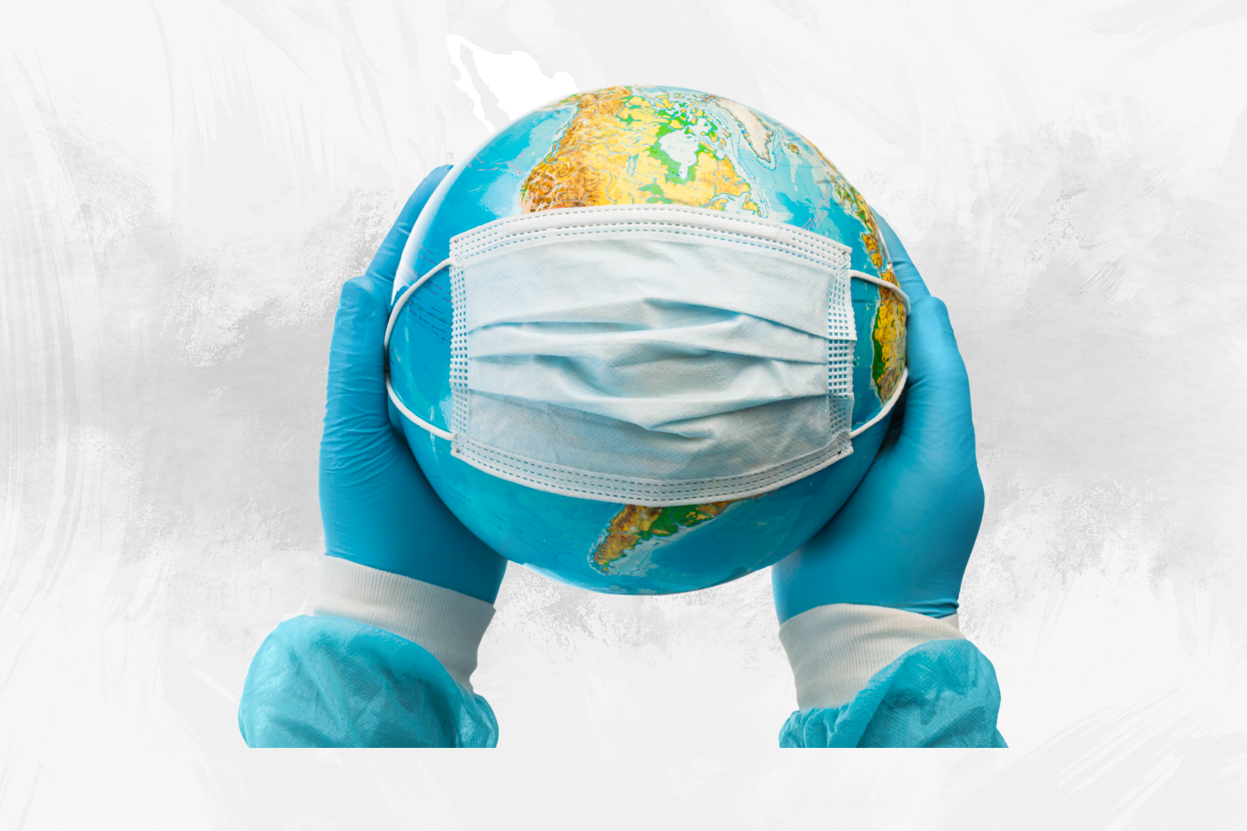 Manos humanas sostienen un globo terráqueo con un cubrebocas, representando la protección global y la cooperación sanitaria internacional